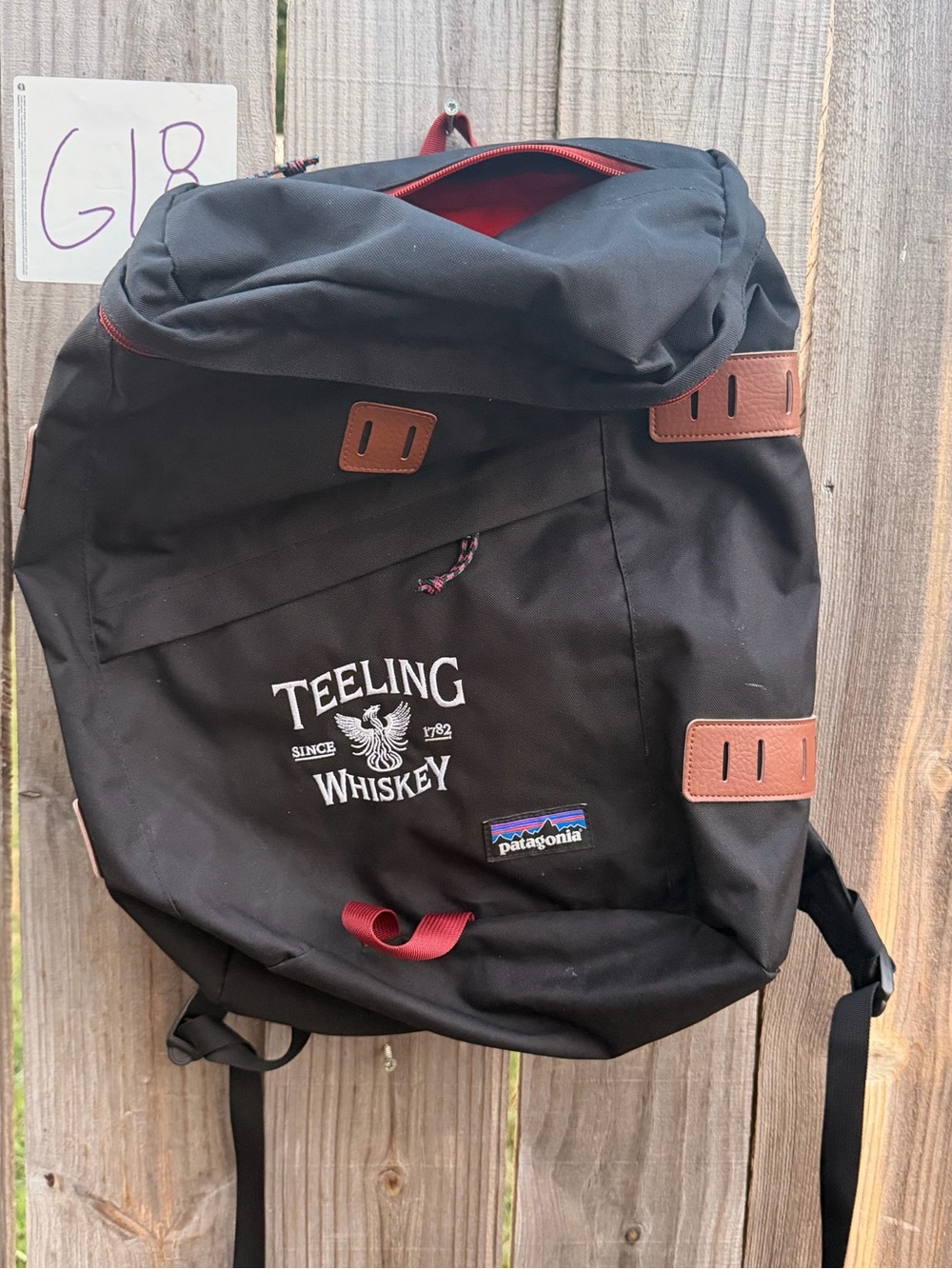 Patagonia Black Backpack with Brown Trim and Red Accents
